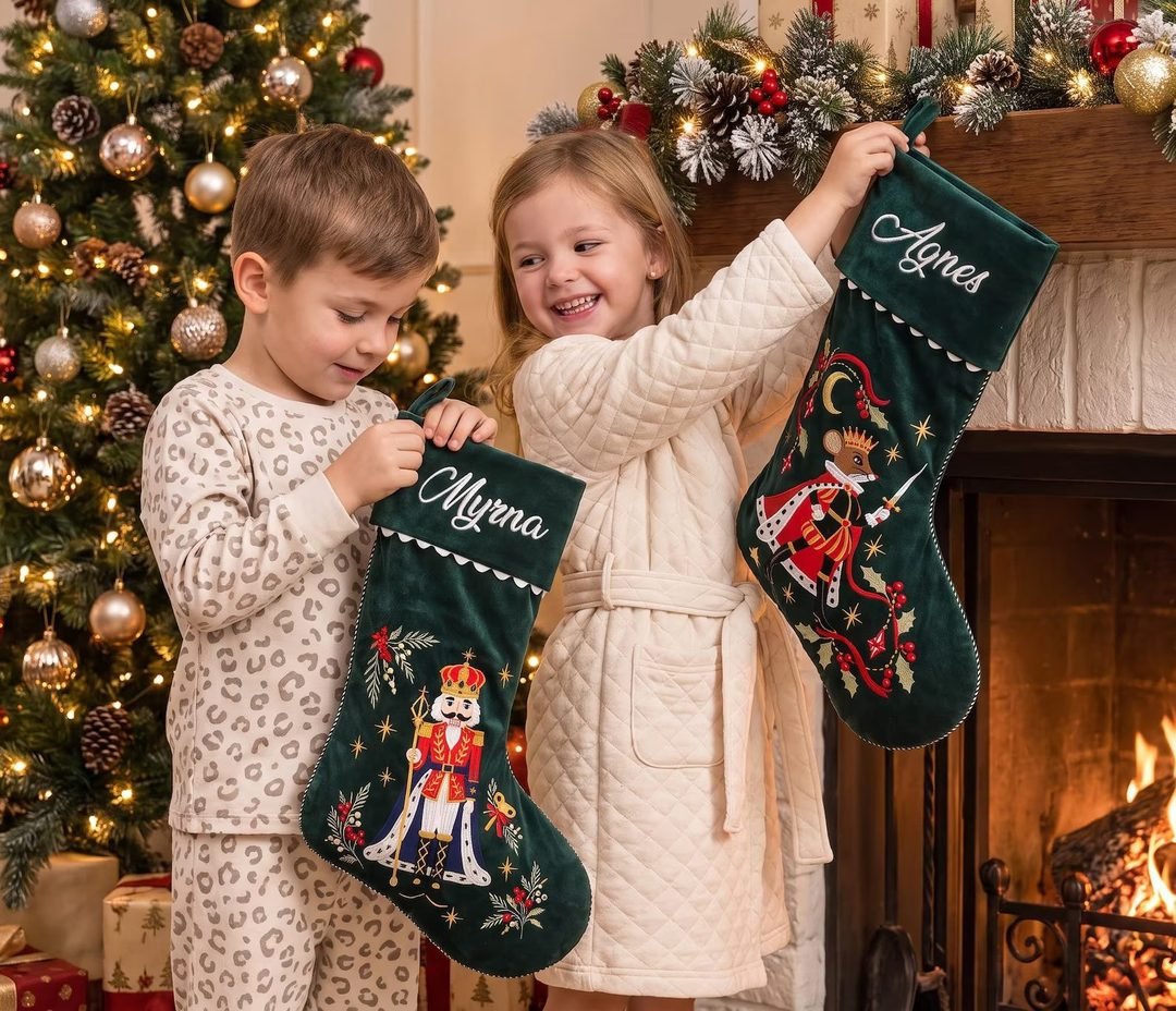 Kids holding Myrna and Agnes stockings